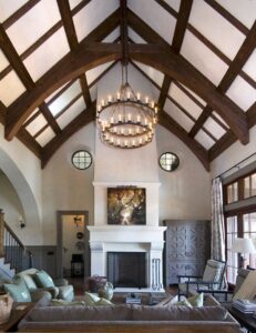 An ornate chandelier installed in a high-ceiling room by McCall Enterprises in Atlanta, GA.