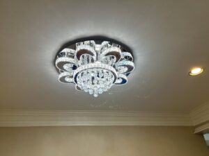 Ornate crystal flush-mount light fixture installed on a ceiling by Perfection Lighting, Design, and Installations in Atlanta, GA.