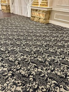 Ornate black and beige patterned carpet in a commercial space, maintained by PROlific Cleaning Services LLC in Indianapolis, IN.