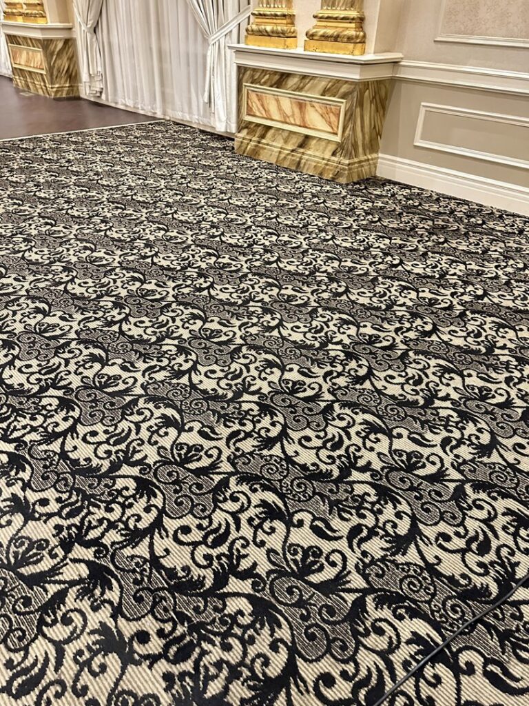 Ornate black and beige patterned carpet in a commercial space, maintained by PROlific Cleaning Services LLC in Indianapolis, IN.