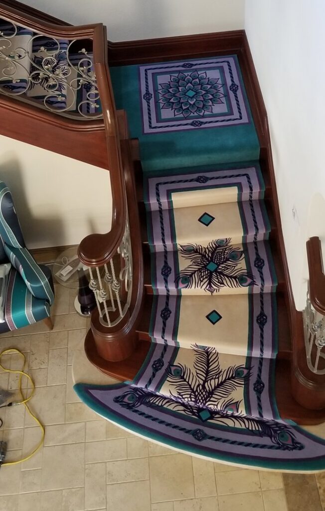 An ornate peacock pattern carpet stair runner installed by The Carpet Workroom in Needham Heights, MA.