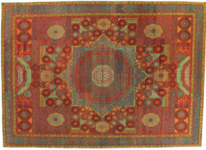 An ornate red and blue traditional carpet, showcasing the quality available from Woven Legends in Philadelphia, PA.