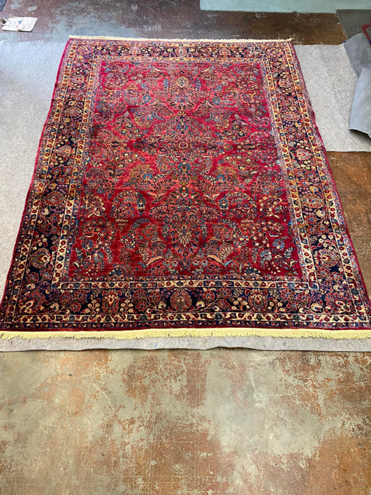 An ornate red rug laid out for cleaning or inspection at Kelly's Carpet Cleaning in Medford, OR