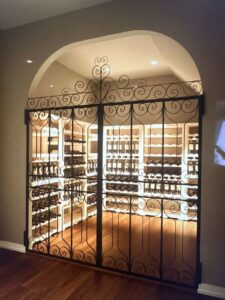 An ornate wrought iron gate for a wine cellar, showcasing custom gate work by Coastline Gate Repair in Los Angeles, CA.