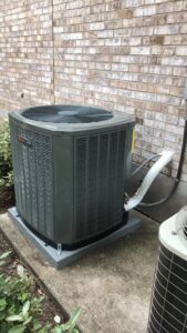A newly installed outdoor AC condenser unit by Blue Sky Heating and Air in Austin, TX.