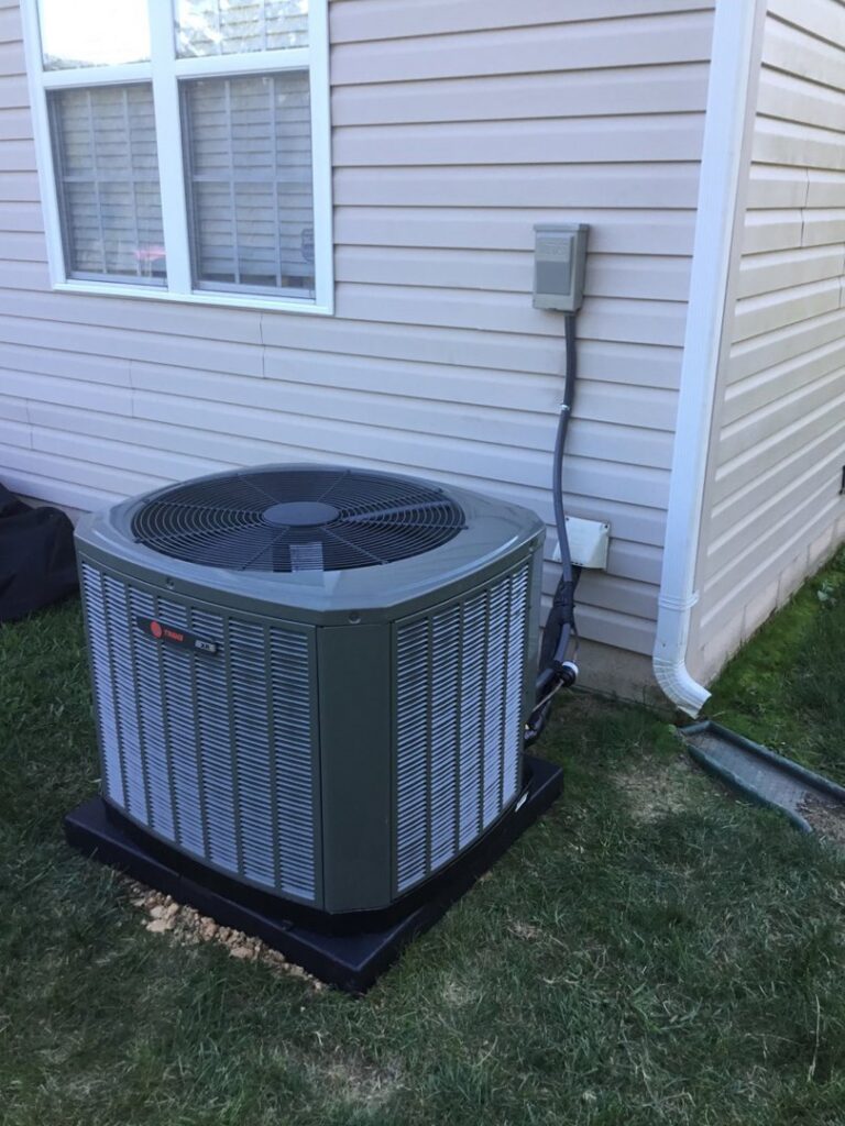 An outdoor air conditioning condenser unit installed by Honesty Services in Rock Hill, SC.
