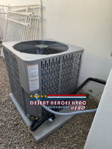 A newly installed outdoor AC condenser unit on a gravel bed by Desert Heroes HVAC in Phoenix, AZ