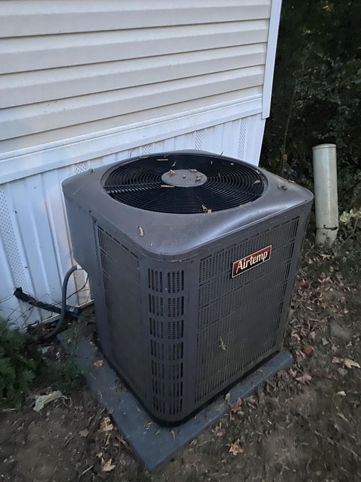An outdoor Airtemp air conditioning condenser unit installed by Fox Heating and Air service in Hueytown, AL.