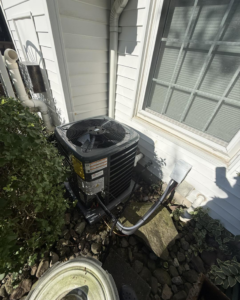 An outdoor AC condenser unit installed by Progressive Heating and Cooling WNY in Buffalo, NY.