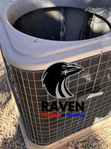 A well-maintained outdoor AC condenser unit serviced by Raven Heating & Cooling in El Paso, TX.