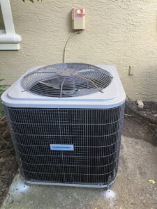An outdoor AC condenser unit installed by Southwest Florida Air Quality in Cape Coral, FL