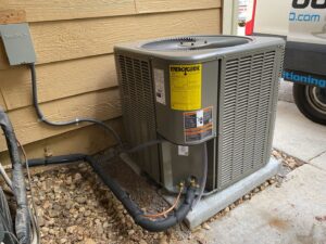 An outdoor air conditioning condenser unit installed by True Heating and Cooling in Northeast Westminster, CO.