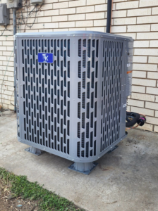 A new outdoor air conditioning condenser unit installed by Xtreme Heating & Cooling in Tulsa, OK