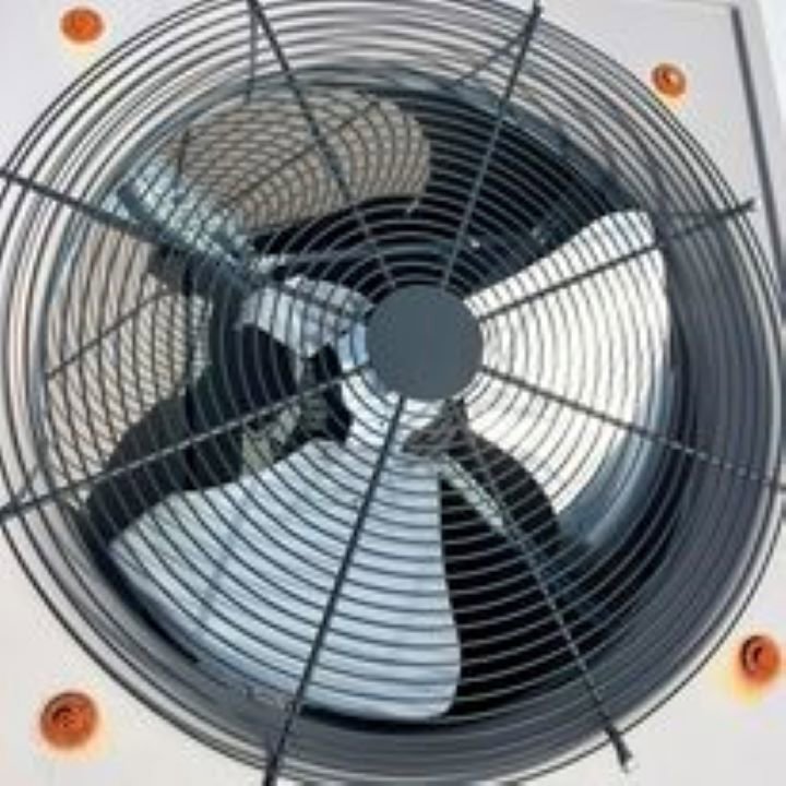 A close-up view of an outdoor air conditioning or heat pump fan unit, part of HVAC services by Advanced Comfort LLC in Concord, NH.