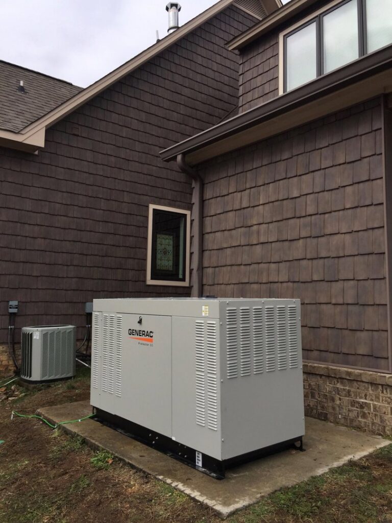 An outdoor air conditioning unit installed next to a Generac whole-home generator by Douglas Cooling & Heating in Pelham, AL.