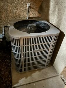 An outdoor AC unit installed next to a home, ready for service by Honest AC Experts in Las Vegas, NV