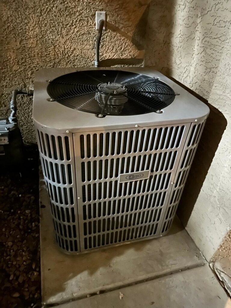 An outdoor AC unit installed next to a home, ready for service by Honest AC Experts in Las Vegas, NV