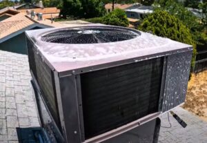 An outdoor AC unit being cleaned with foam for maintenance by RESTQ HVAC Repairs & Services in Rockville, MD.