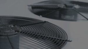 A clear close-up view of the fan grill on an outdoor air conditioning unit by S&S Mechanical in St. George, UT