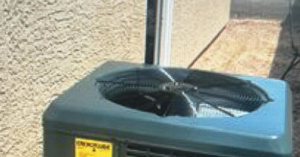 A close-up view of an outdoor AC unit fan, serviced by Mechanical Express in Henderson, NV.