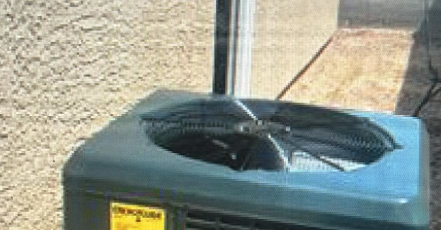 A close-up view of an outdoor AC unit fan, serviced by Mechanical Express in Henderson, NV.
