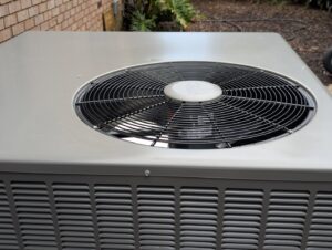 A close-up view of the top fan of an outdoor air conditioning unit, serviced by Pardee Service Experts in Charleston, SC.