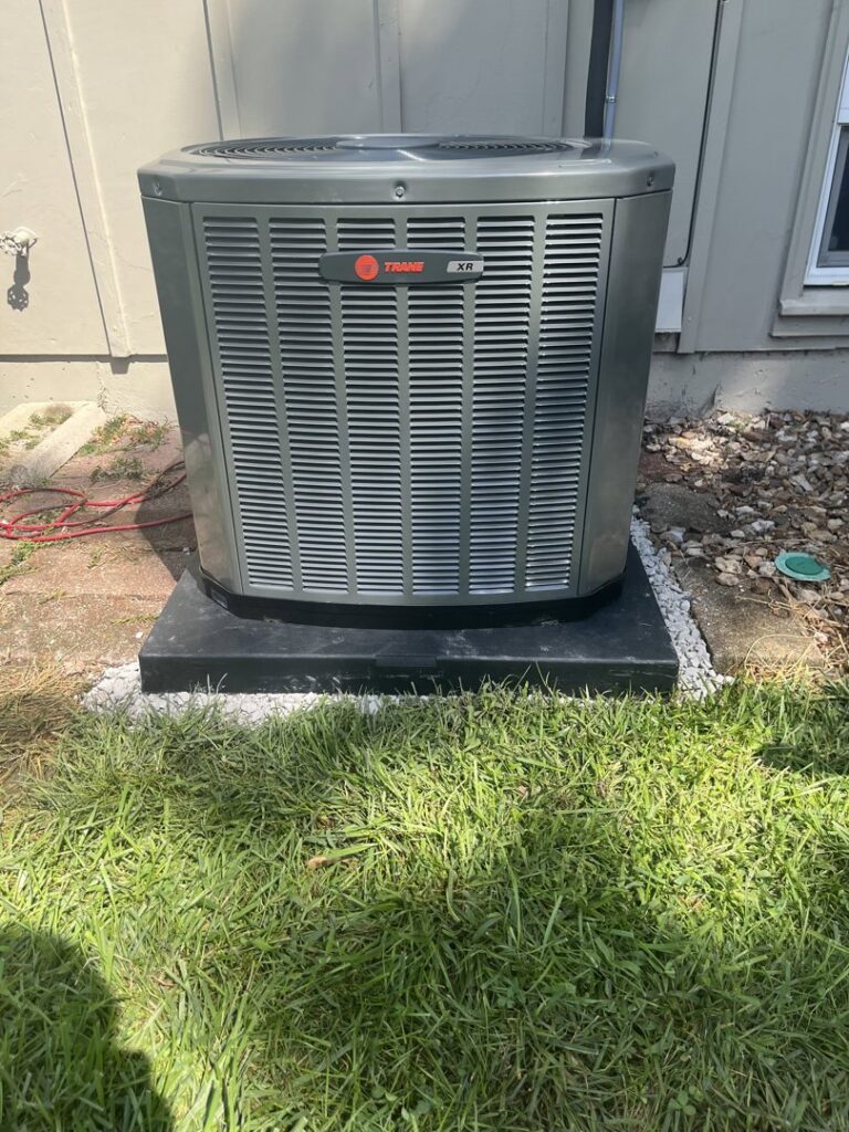 A newly installed Trane XR outdoor AC unit by A-Team PHC in Olathe, KS, ready to provide cooling.