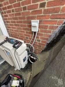 An outdoor AC unit installation in progress by Daniels HVAC Philadelphia LLC in Philadelphia, PA.