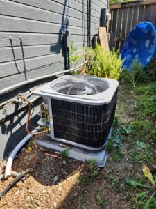 An outdoor air conditioning unit recently installed by Finney Heating and Cooling LLC in Post Falls, ID.