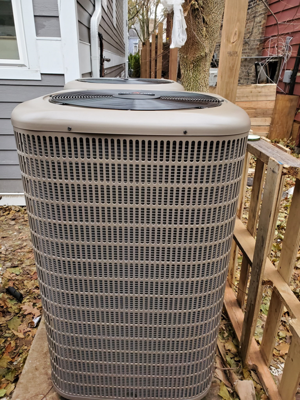 An outdoor air conditioning unit installed by Giant HVAC in Chicago, IL