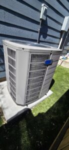 Newly installed outdoor AC unit next to a residential home by HVAC Ministries LLC in Salem, OR