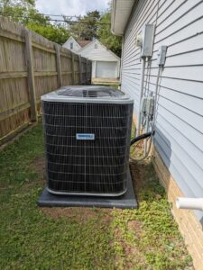 A newly installed outdoor air conditioning unit by Mucciante Heating & Cooling, providing cooling services in Pekin, IL.