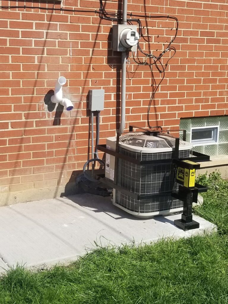 An outdoor AC unit with a security cage installed by Naranjo Heating & Cooling Specialist Inc. in Joliet, IL.