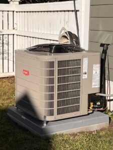 A newly installed Bryant outdoor AC unit next to a home by Reliable Heating and Air LLC in Summerville, SC.