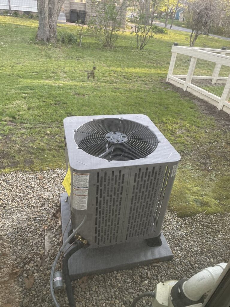 A newly installed outdoor air conditioning unit by Roy Rogers Heating and Air in Indianapolis, IN.