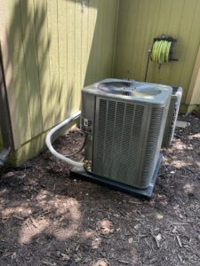 A newly installed outdoor AC unit by Spartan Mechanical KC in Spring Hill, KS, ready to provide cooling.