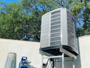 An outdoor AC unit installed on an elevated stand with HVAC tools nearby by Air Zero in Largo, FL