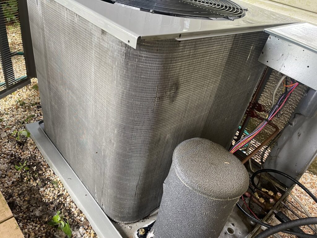 An outdoor air conditioning unit undergoing maintenance by Brothers HVAC LLC in Owings Mills, MD