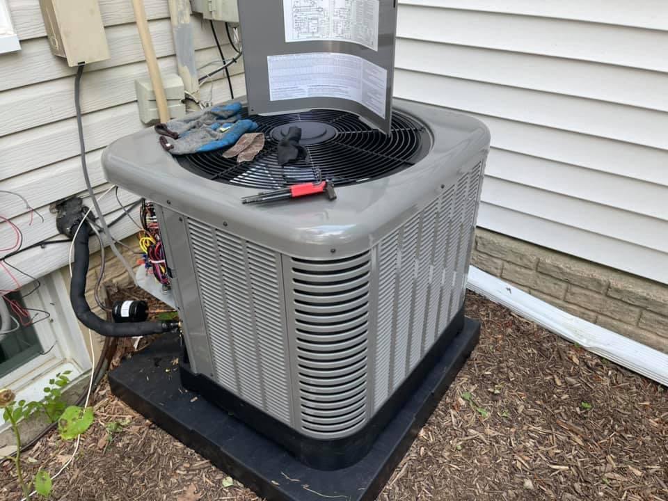 An outdoor air conditioning unit undergoing maintenance by Wilcox Services in Temple Hills, MD.
