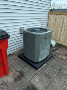An outdoor air conditioning unit installed by Michael Savage-Lanz Heating & Cooling in Champaign, IL