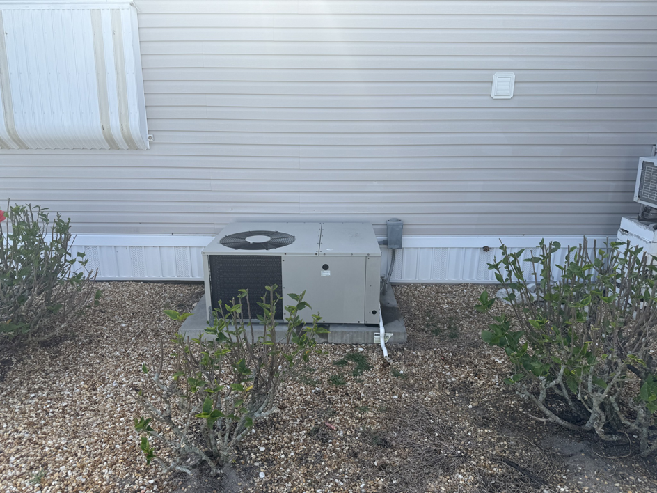 An outdoor AC unit installed for a mobile home by NextGen Aire of Southwest Florida in Punta Gorda, FL.
