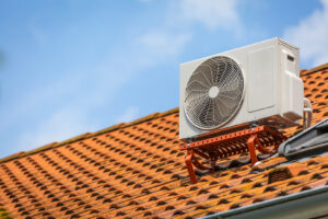 An outdoor air conditioning unit installed on a residential roof by A's Heating and Cooling LLC in Portland, OR.