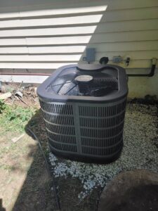 An outdoor air conditioning unit replacement by Working Wolves Heating & Cooling LLC in Lawrence, KS.