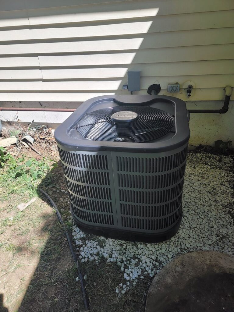 An outdoor air conditioning unit replacement by Working Wolves Heating & Cooling LLC in Lawrence, KS.