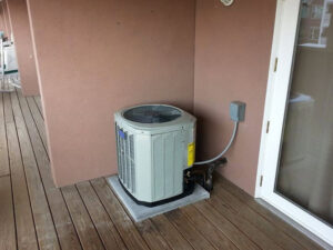 An outdoor air conditioning unit next to a residential home by Complete Comfort Heating & Cooling in Kenosha, WI.