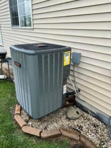 A residential outdoor air conditioning unit installed by DJ's Heating & Air Conditioning in Wilmington, IL.