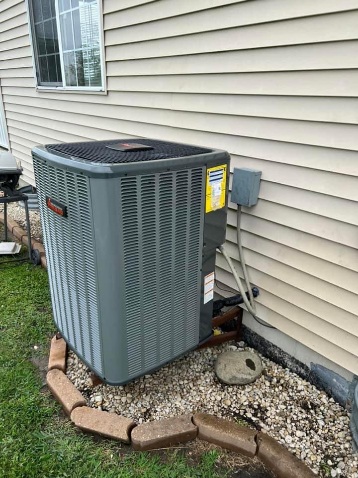 A residential outdoor air conditioning unit installed by DJ's Heating & Air Conditioning in Wilmington, IL.