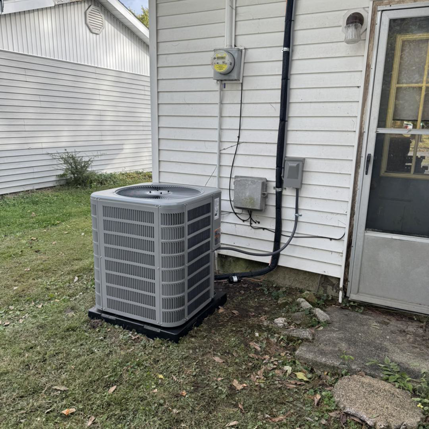 A newly installed outdoor residential AC unit by Brown's Heating & Air Conditioning in Columbia, TN.
