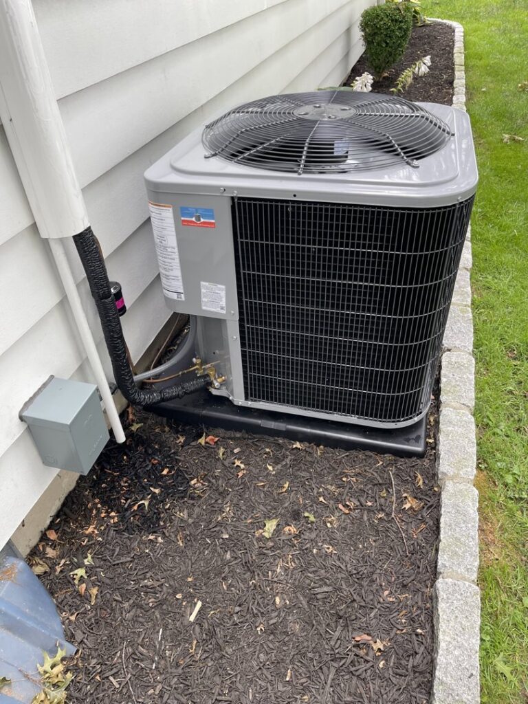 An outdoor air conditioning unit providing cooling for a residential home by MAC Heating and Cooling LLC in Waterbury, CT.