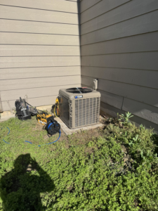 An outdoor York AC unit being serviced by G.M. AIR Conditioning & Heating in Wichita, KS.